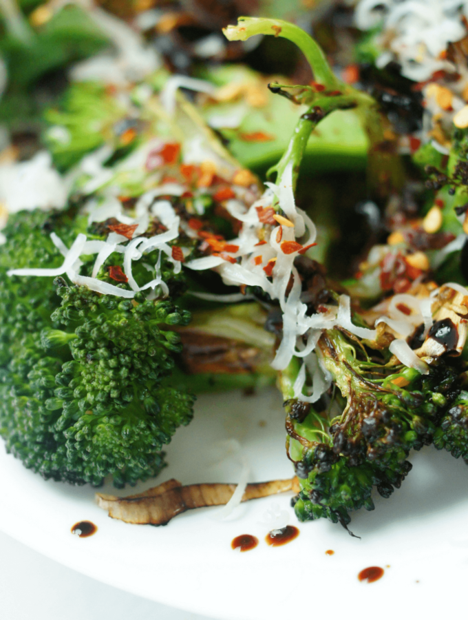 Seared broccoli florets with a little cheese, red pepper flakes and reduced balsamic vinegar over the top.