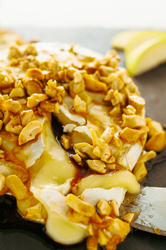 Baked warm brie cheese with cashews