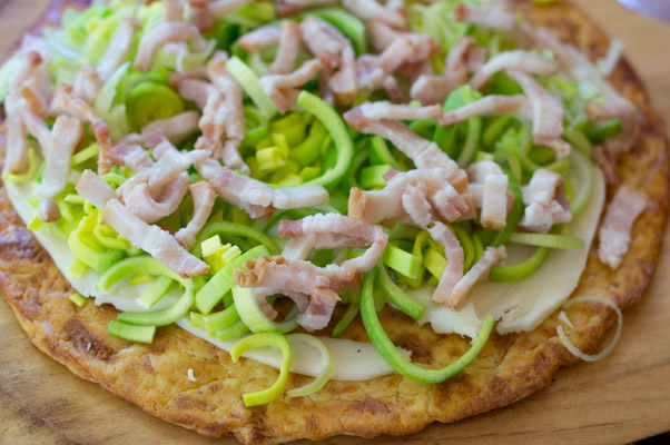 Low carb piza crust with bacon and leeks before it's cooked