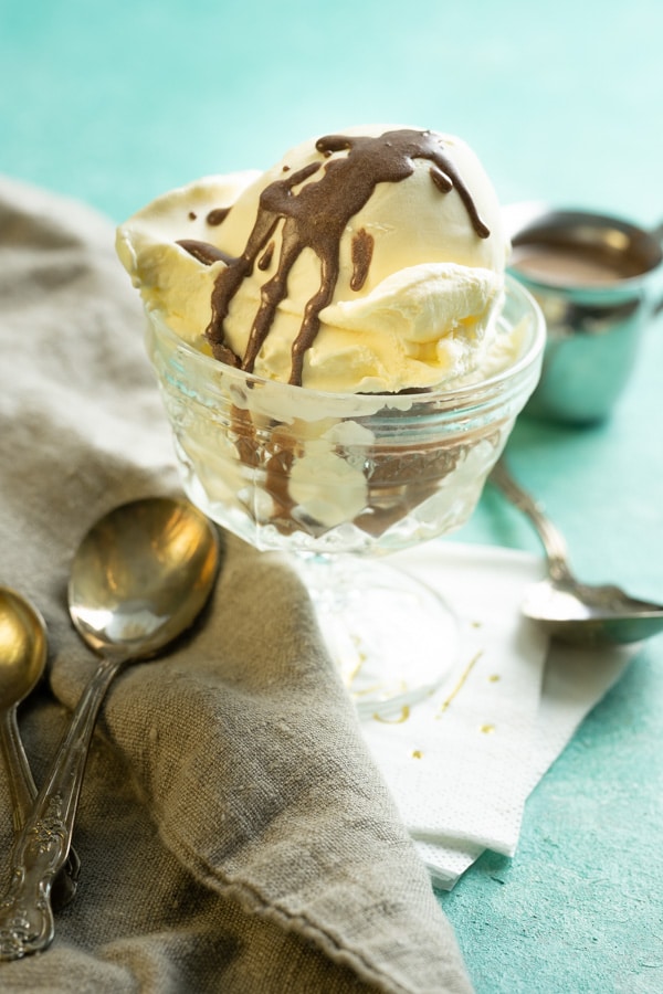 Best keto ice cream recipe in a glass dish with chocolate shell